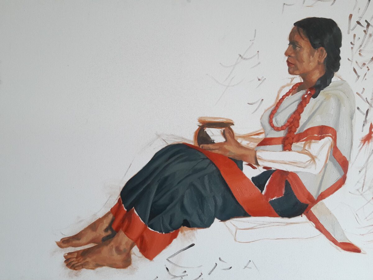 Woman in traditional dress painting